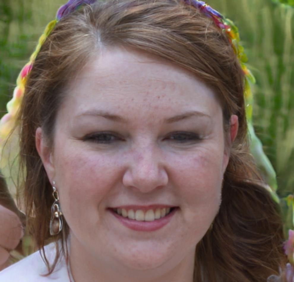 Sarah Williams, Program Coordinator helping students with financial analysis coursework